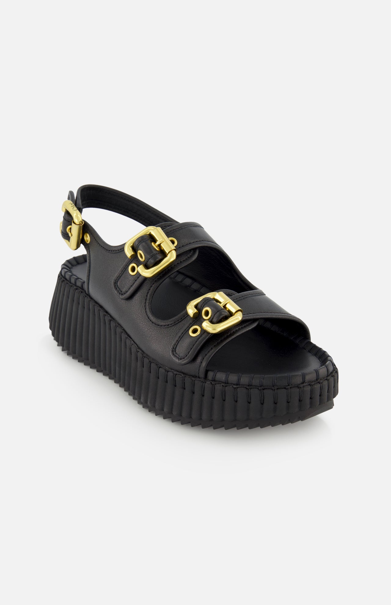 The Nama Buckle Wedge Sandals by CHLOÉ feature black leather, a thick ridged platform sole, two gold buckle straps across the top, and an adjustable gold buckle strap at the heel, shown against a white background.