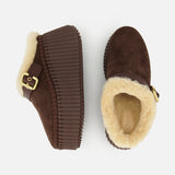 A pair of Nama Suede Slippers by CHLOÉ featuring brown suede mule platform slip-ons with thick, ridged soles, plush shearling lining, and gold buckles. One slipper is displayed from the side and the other from above against a white background.