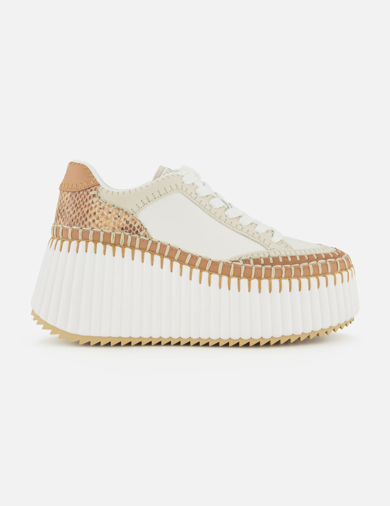 The CHLOÉ Nama Wedge Sneaker features cream and tan leather, textured stitching, white laces, a thick ridged white sole, and a mixed-material upper—ideal for anyone seeking modern statement sneakers.