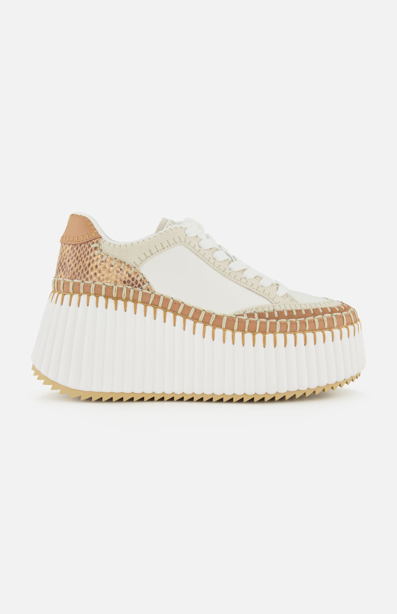 The CHLOÉ Nama Wedge Sneaker features cream and tan leather, textured stitching, white laces, a thick ridged white sole, and a mixed-material upper—ideal for anyone seeking modern statement sneakers.