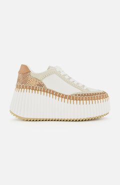 The CHLOÉ Nama Wedge Sneaker features cream and tan leather, textured stitching, white laces, a thick ridged white sole, and a mixed-material upper—ideal for anyone seeking modern statement sneakers.