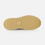 The image displays the bottom view of a beige Nama Wedge Sneaker sole with horizontal grooves and the CHLOÉ logo embossed in a central circle, highlighting its distinctive design against a plain white background.