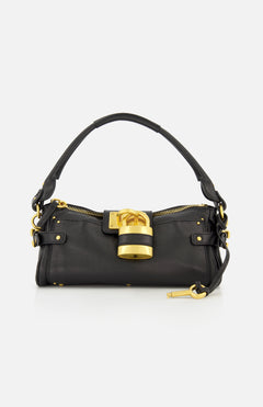 The CHLOÉ Paddington Removable Strap Shoulder Bag features black leather, a short handle, gold hardware, and an oversized padlock accent on the front. A small gold key hangs from one side of the bag. The background is plain white.