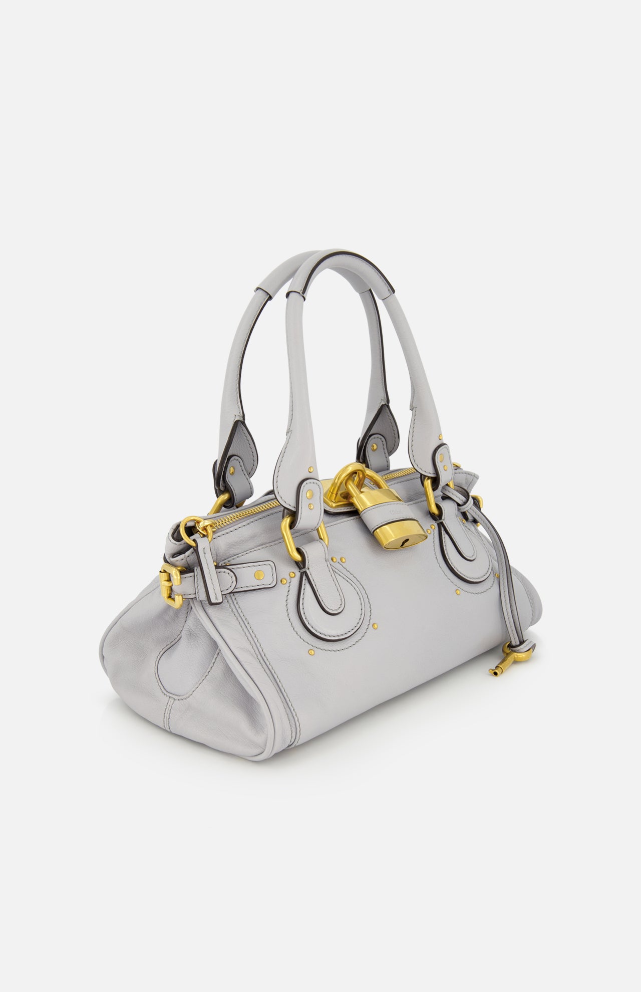 A CHLOÉ Paddington Shoulder Bag in light gray leather, featuring double handles, gold-tone hardware, and an oversized padlock on the front, displayed against a plain white background.