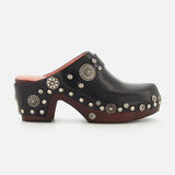 CHLOÉ Talis Studded Leather Clogs in black, featuring a slip-on design with a wooden heel and platform decorated with silver-tone floral and circular studs.