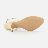 The CHLOÉ Zia Crystal Chain Heels, featuring gold strappy high heel design with a smooth sole and slender heel, are displayed from the bottom against a plain white background, showcasing their refined craftsmanship reminiscent of luxurious Italian footwear.