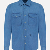 The CLOSED Army Long Sleeve Shirt, a regular fit blue denim style, features a collar, button-down front, and two chest patch pockets with button flaps, shown on a plain white background.