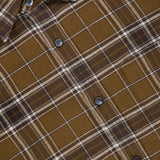 A close-up of the Basic Plaid Shirt by CLOSED, featuring a brown plaid pattern with white and gray lines, crafted from soft cotton. The shirt displays the CLOSED brand tag and has several visible buttons down the front—making it an ideal fall shirt for men.