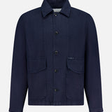 The Linen Cargo Jacket by CLOSED features a button-front closure, collared neckline, long sleeves, and two large front flap pockets in navy linen, shown against a white background.