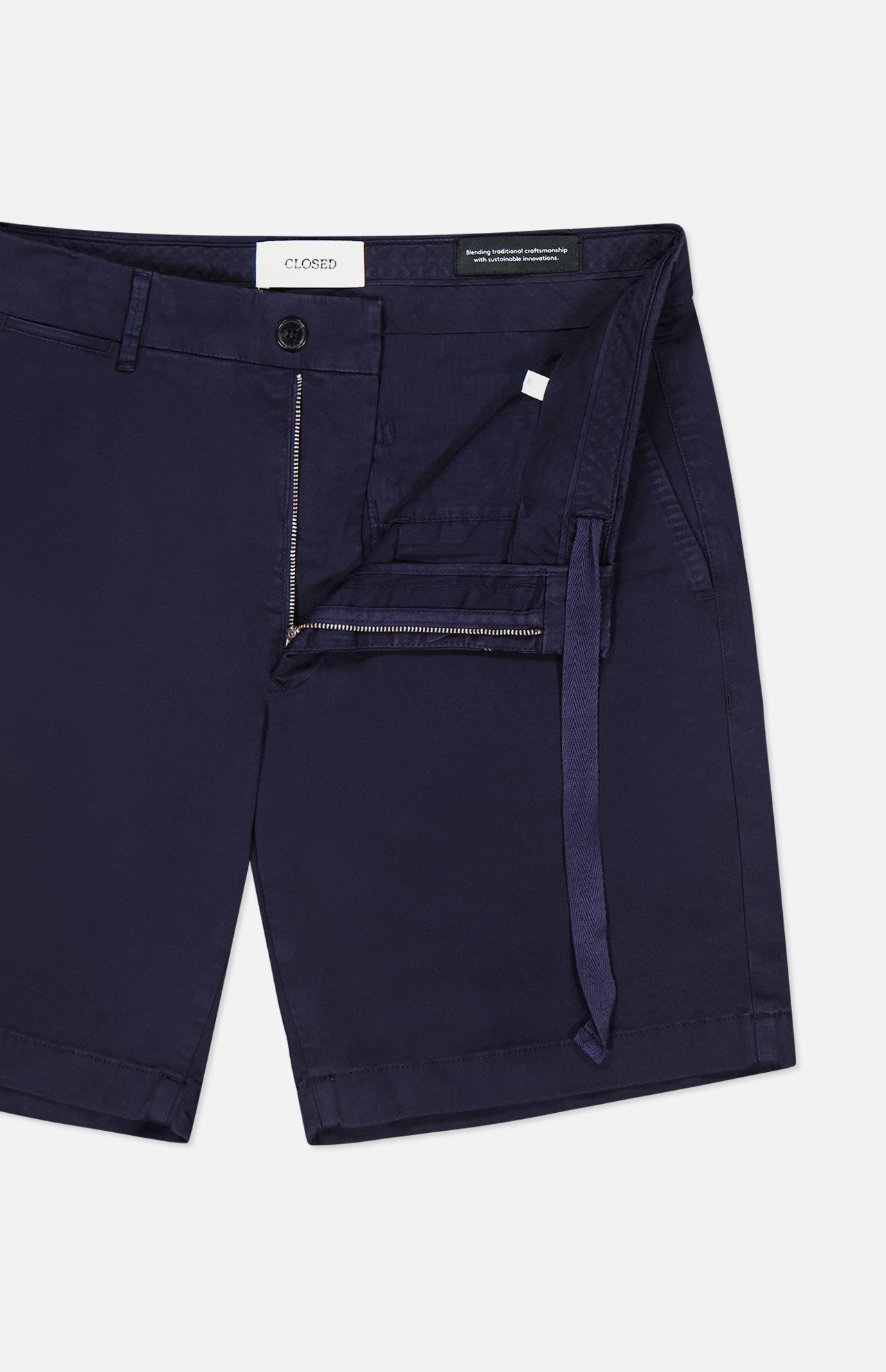 CLOSED Classic Chino Shorts in navy stretch cotton twill feature a zipper fly, button closure, belt loops, and an interior waist tie, with a partially unzipped design highlighting the inside details.