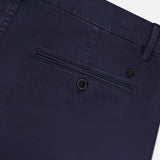 Close-up of the back of CLOSED Classic Chino Shorts in navy stretch cotton twill, featuring a single buttoned welt pocket, belt loop, and part of the waistband.