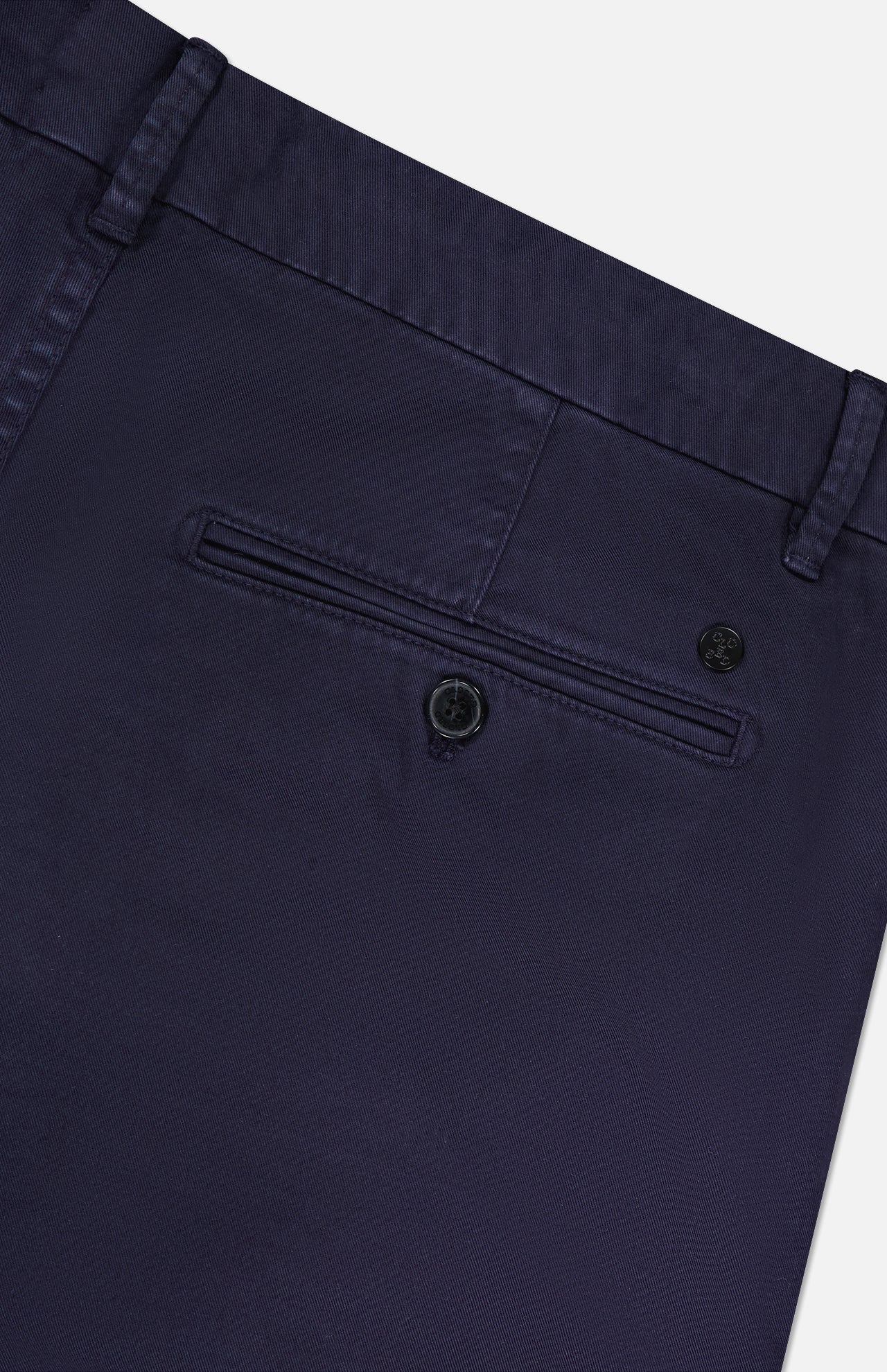 Close-up of the back of CLOSED Classic Chino Shorts in navy stretch cotton twill, featuring a single buttoned welt pocket, belt loop, and part of the waistband.