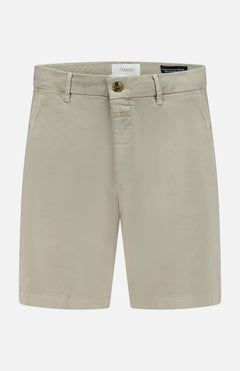 The CLOSED Classic Chino Shorts in beige are made from stretch cotton twill with belt loops, side pockets, and a front button and zip closure, shown against a white background.