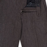 The Fairport Relaxed Trouser Pant by CLOSED is a high-waisted, straight leg style in dark brown, featuring a partially open zipper, button closure, and visible waistband lining.