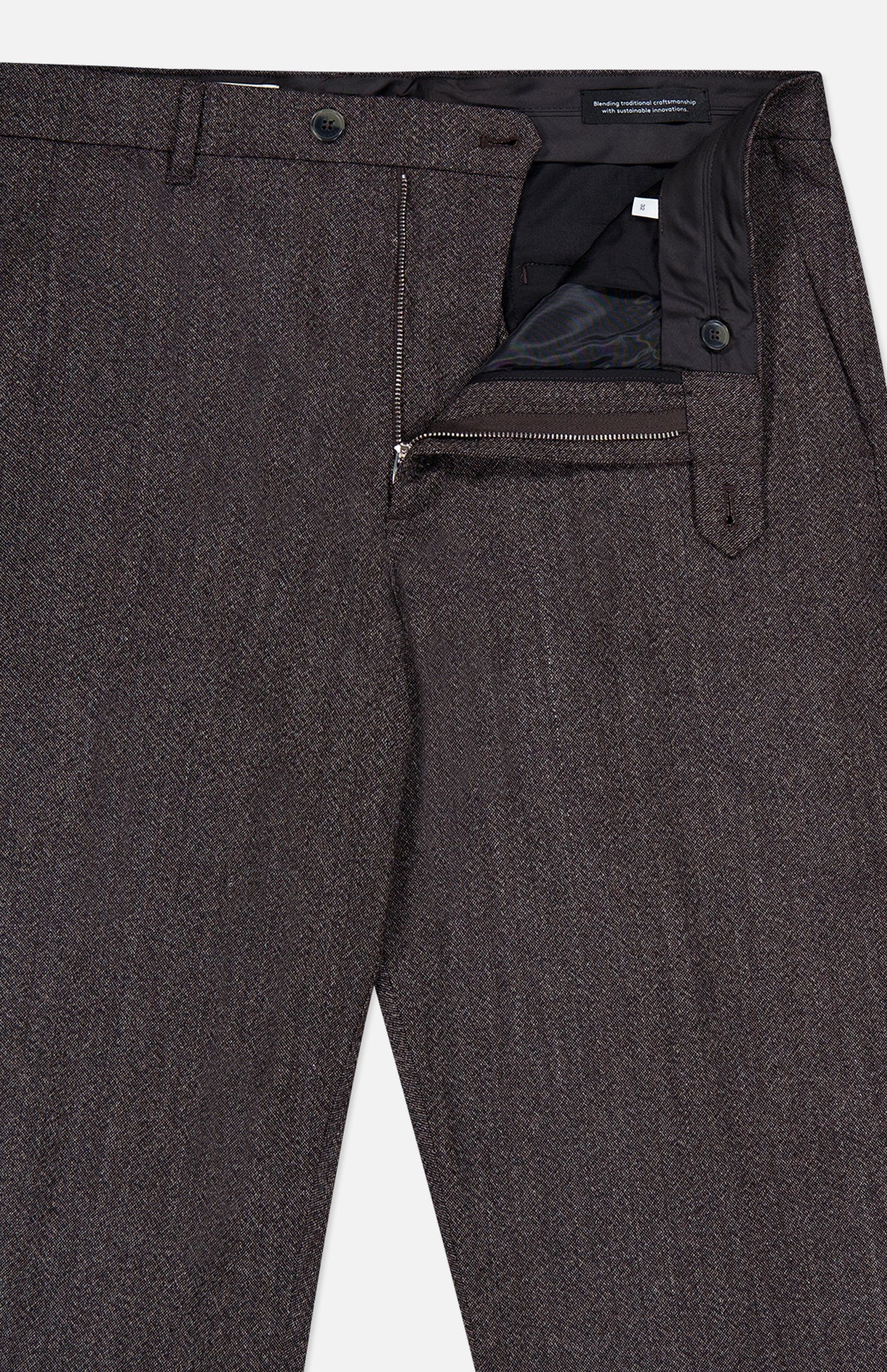 The Fairport Relaxed Trouser Pant by CLOSED is a high-waisted, straight leg style in dark brown, featuring a partially open zipper, button closure, and visible waistband lining.