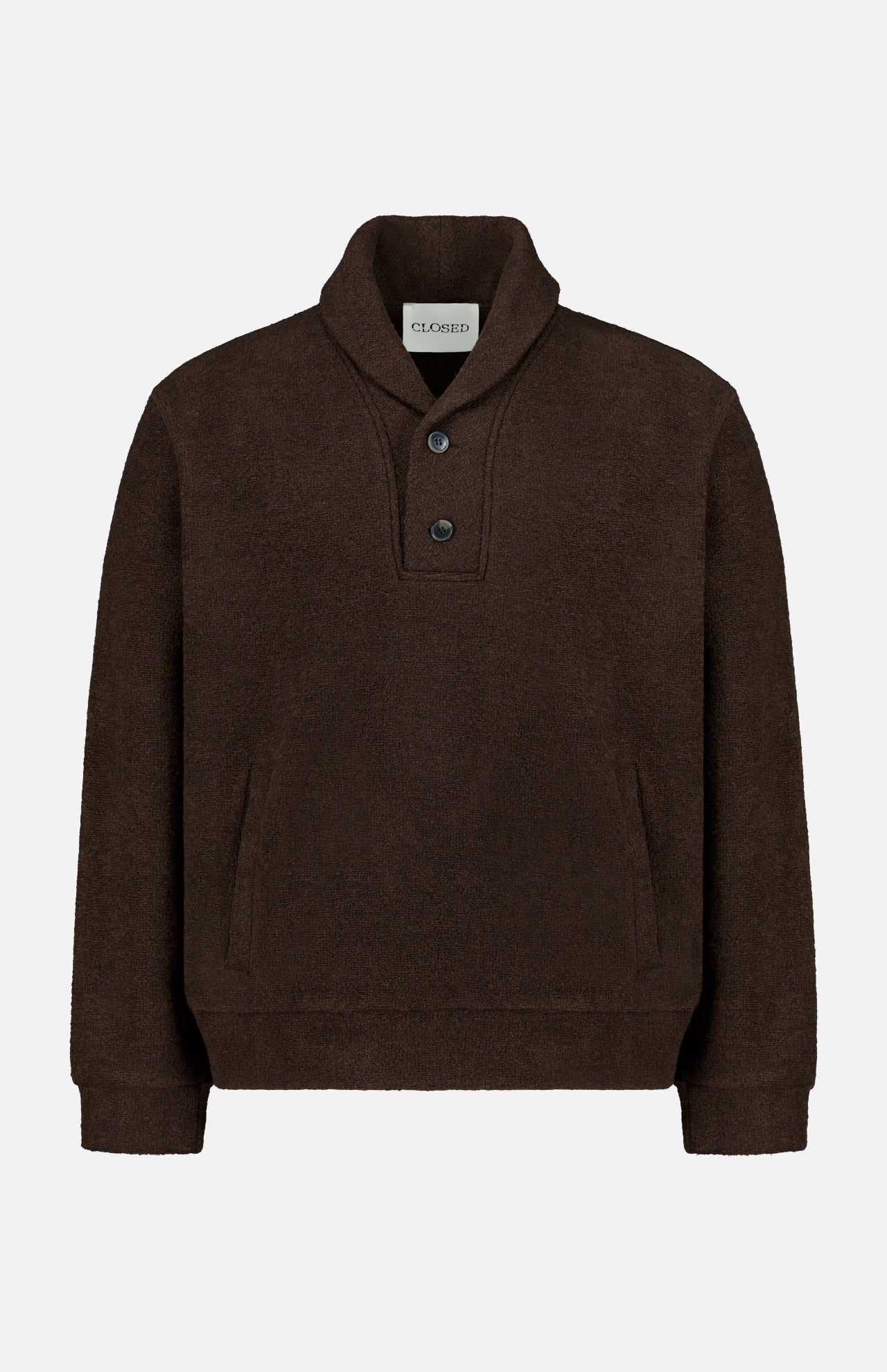 The Shawl Collar Sweater by CLOSED is a dark brown women’s pullover featuring long sleeves, a shawl collar with two buttons at the neck, a kangaroo pocket, and ribbed cuffs and hem. The label inside the collar displays the CLOSED brand. This sweater is presented on a plain white background.