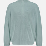 The CLOSED Half Zip Jumper Sweater is a light blue-green cotton-blend pullover featuring a high collar, silver quarter-zip closure, long sleeves with ribbed cuffs, and a relaxed fit, shown against a plain white background.