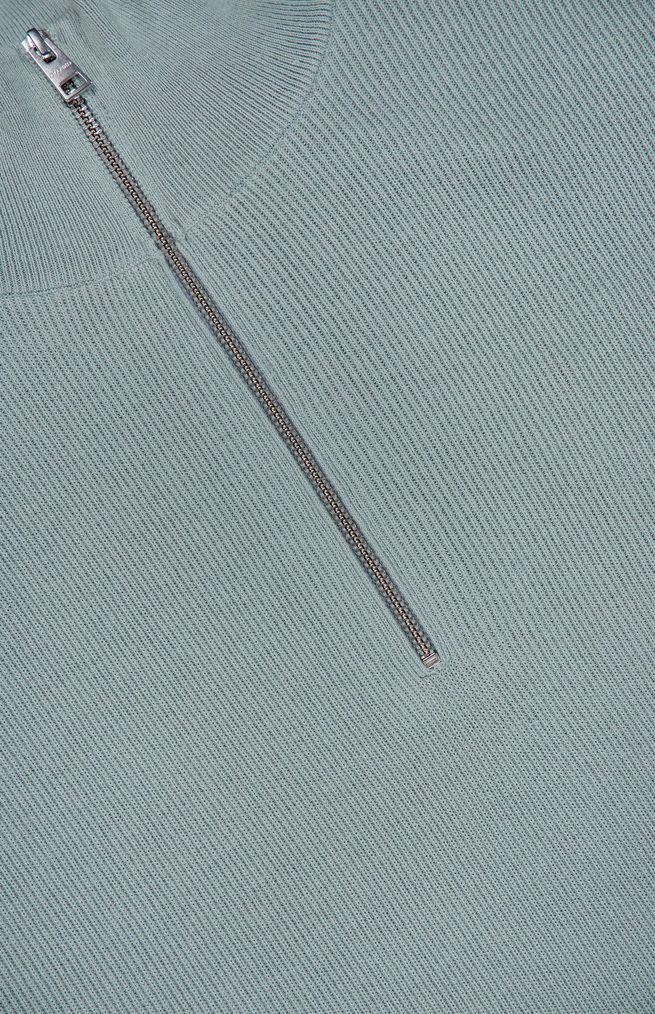 Close-up of the Half Zip Jumper Sweater by CLOSED, shown in pale blue ribbed knit cotton-blend fabric with a silver half zipper partially unzipped to showcase the texture and refined details of this pullover.