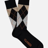 Step out in style with CLOSED’s Argyle Socks: a pair of black melange socks adorned with a beige, light gray, and orange argyle design. The sole is stamped with the brand’s name in bold orange text. These multicolored socks offer a preppy collegiate vibe and are shown here on a clean white background.