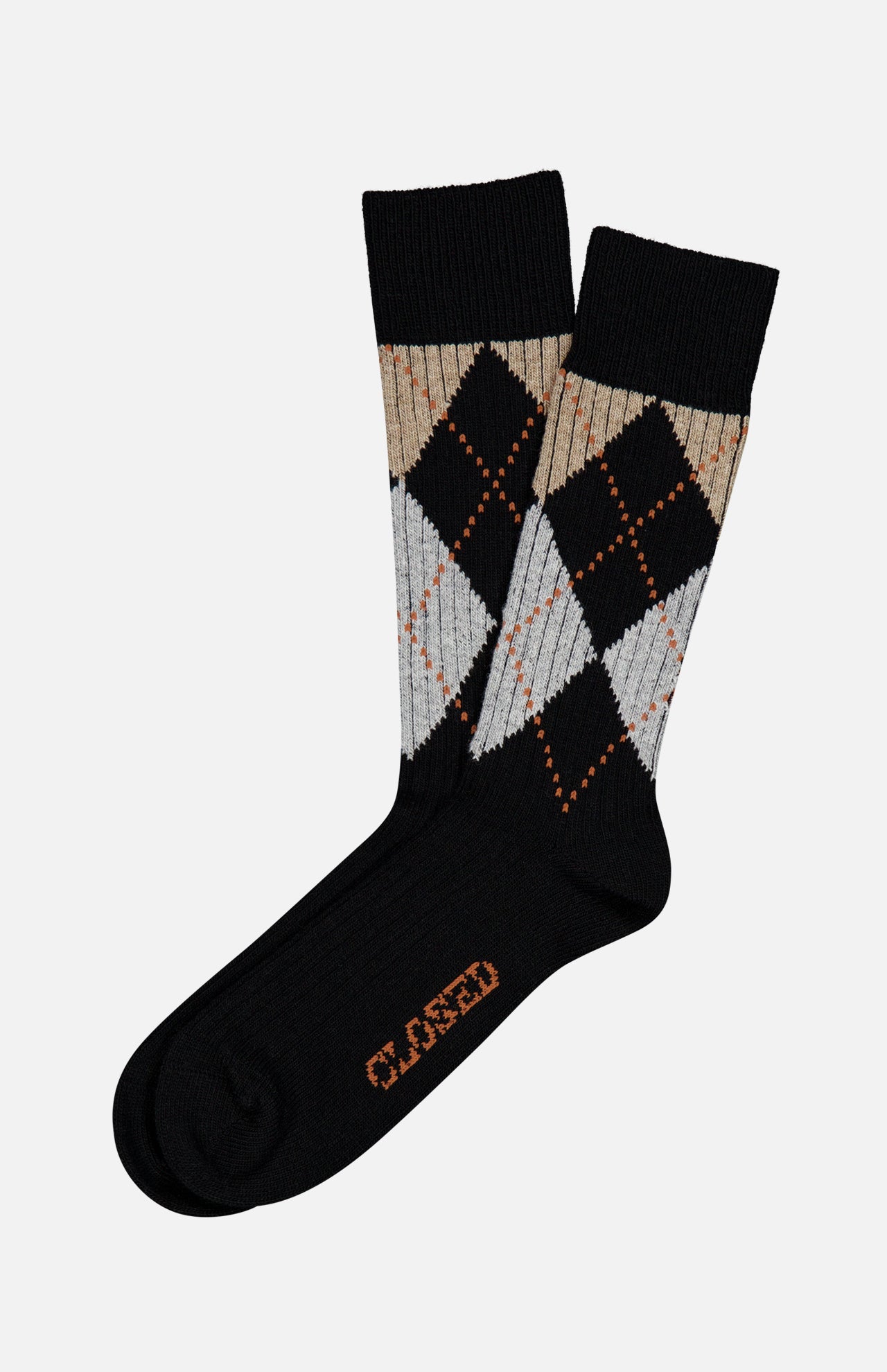 A pair of Argyle Socks by CLOSED in black melange, featuring a gray, beige, and orange multicolored argyle pattern. “CLOSED” is printed in orange on the soles for a preppy collegiate accent.
