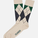 A pair of CLOSED Argyle Socks in a cream color, featuring a green and navy argyle pattern and “CLOSED” printed on the sole.