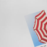 The CLOSED Printed Graphic T-Shirt is made from organic cotton and showcases a photo print of a red-and-white striped beach umbrella against a blue sky, with "GOOD TIMES AND TAN LINES" below the image.