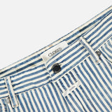 Close-up of CLOSED Springdale Relaxed Stripe Pants—blue and white vertical stripes, 100% cotton denim, made in Italy, with belt loops, front button, and an inner waistband label reading CLOSED.