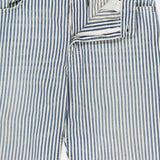 The CLOSED Springdale Relaxed Stripe Pants feature blue and white vertical stripes, Italian craftsmanship, and a relaxed fit. Shown laid flat on a white background with zipper partially open to reveal inner fabric and stitching details.