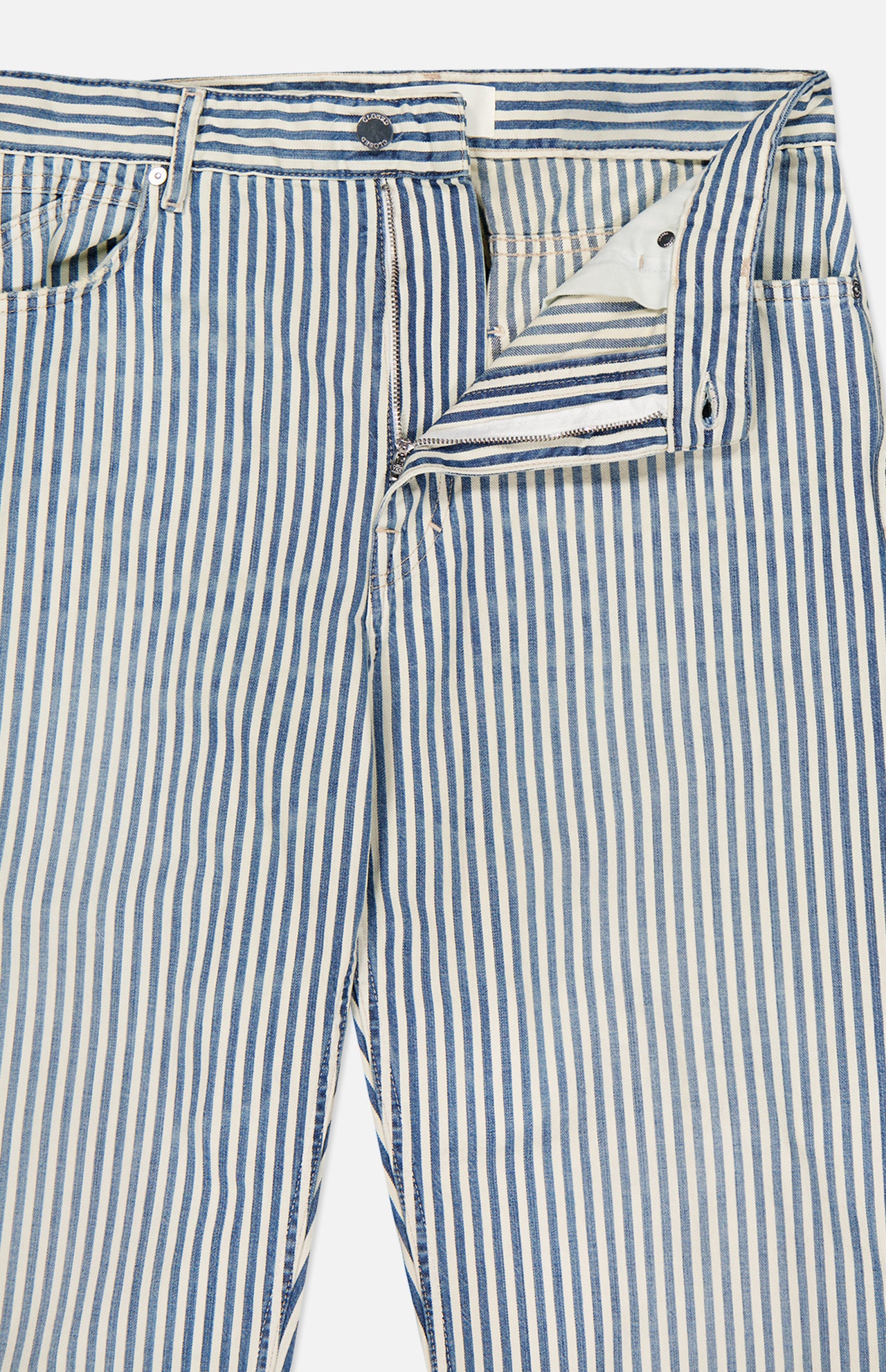 The CLOSED Springdale Relaxed Stripe Pants feature blue and white vertical stripes, Italian craftsmanship, and a relaxed fit. Shown laid flat on a white background with zipper partially open to reveal inner fabric and stitching details.