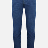 The Unity Slim Jean by CLOSED is a pair of classic dark blue denim jeans featuring a slim fit, front button and zipper closure, and five pockets. Made in Italy, they are displayed against a white background.
