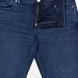 A pair of CLOSED Unity Slim Jeans crafted from dark blue denim with a partially unzipped fly and an unbuttoned waistband, laid flat on a white background.