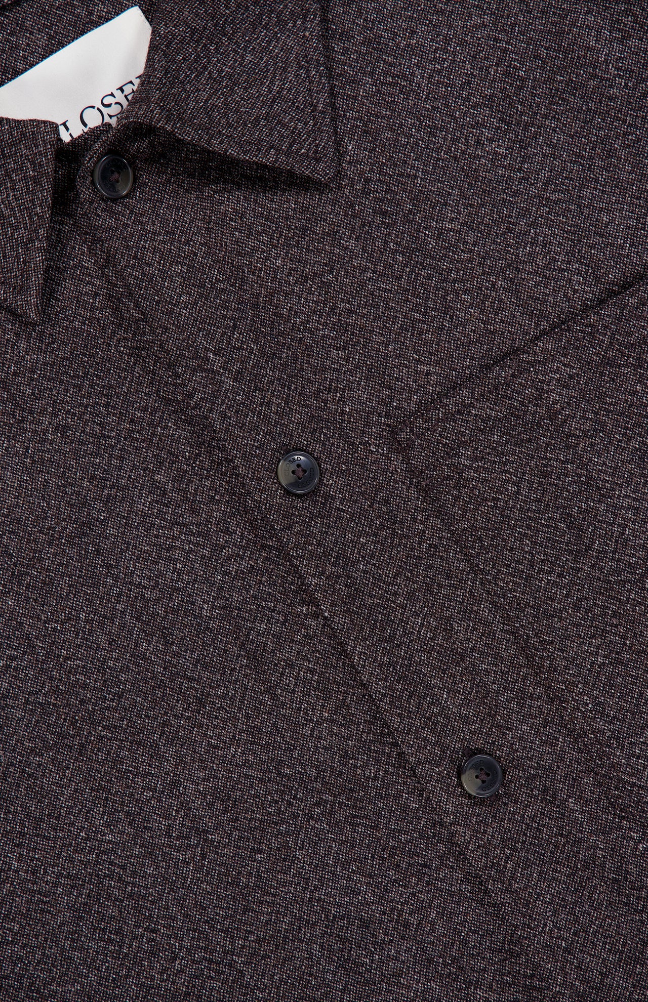 Close-up of the CLOSED Wool-blend Overshirt in dark brown, featuring a textured, finely woven Italian fabric. The overshirt has black buttons and a pointed collar, with a glimpse of the white label visible inside.