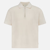 The CLOSED Zipped Neck Polo Shirt is a cream, short-sleeve polo crafted from textured cotton, featuring a collar and silver zip detail, shown on a plain white background.