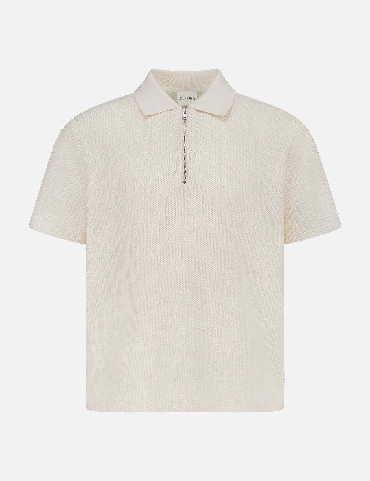 The CLOSED Zipped Neck Polo Shirt is a cream, short-sleeve polo crafted from textured cotton, featuring a collar and silver zip detail, shown on a plain white background.