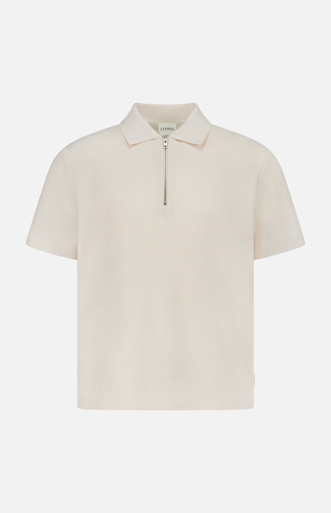 The CLOSED Zipped Neck Polo Shirt is a cream, short-sleeve polo crafted from textured cotton, featuring a collar and silver zip detail, shown on a plain white background.