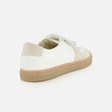 The COMMON PROJECTS Bball Duo Leather and Suede Sneaker is displayed from a rear angle against a white background, highlighting its white and beige design with a gum sole. Signature gold numbers are stamped near the heel, emphasizing the refined details of this luxury low-top shoe.
