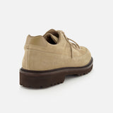 The COMMON PROJECTS Hiker Low Suede Piuma Boot in tan suede is displayed at a back angle, highlighting its lace-up design and thick, dark brown sole. Size and style numbers are stamped on the side near the heel.