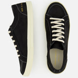 A pair of COMMON PROJECTS Premium Skate In Nubuck Sneakers in black, featuring white soles and white laces, is displayed from top and side angles against a plain light background. These luxury low-top sneakers blend classic style with modern sophistication.