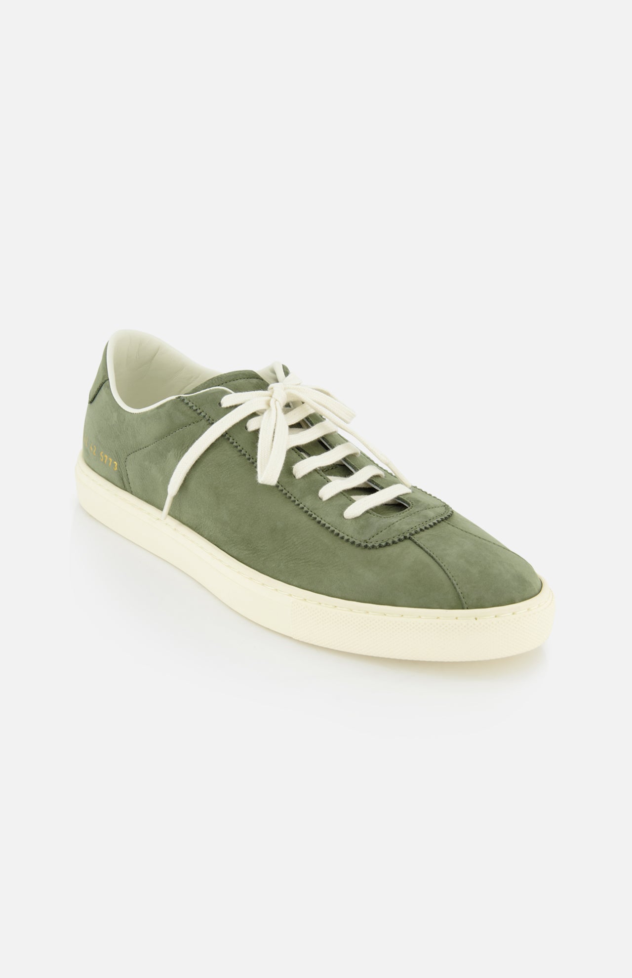 The COMMON PROJECTS Leather Tennis Sneaker in army green suede features white laces and a cream sole, showcased on a white background for a look of minimalist elegance.