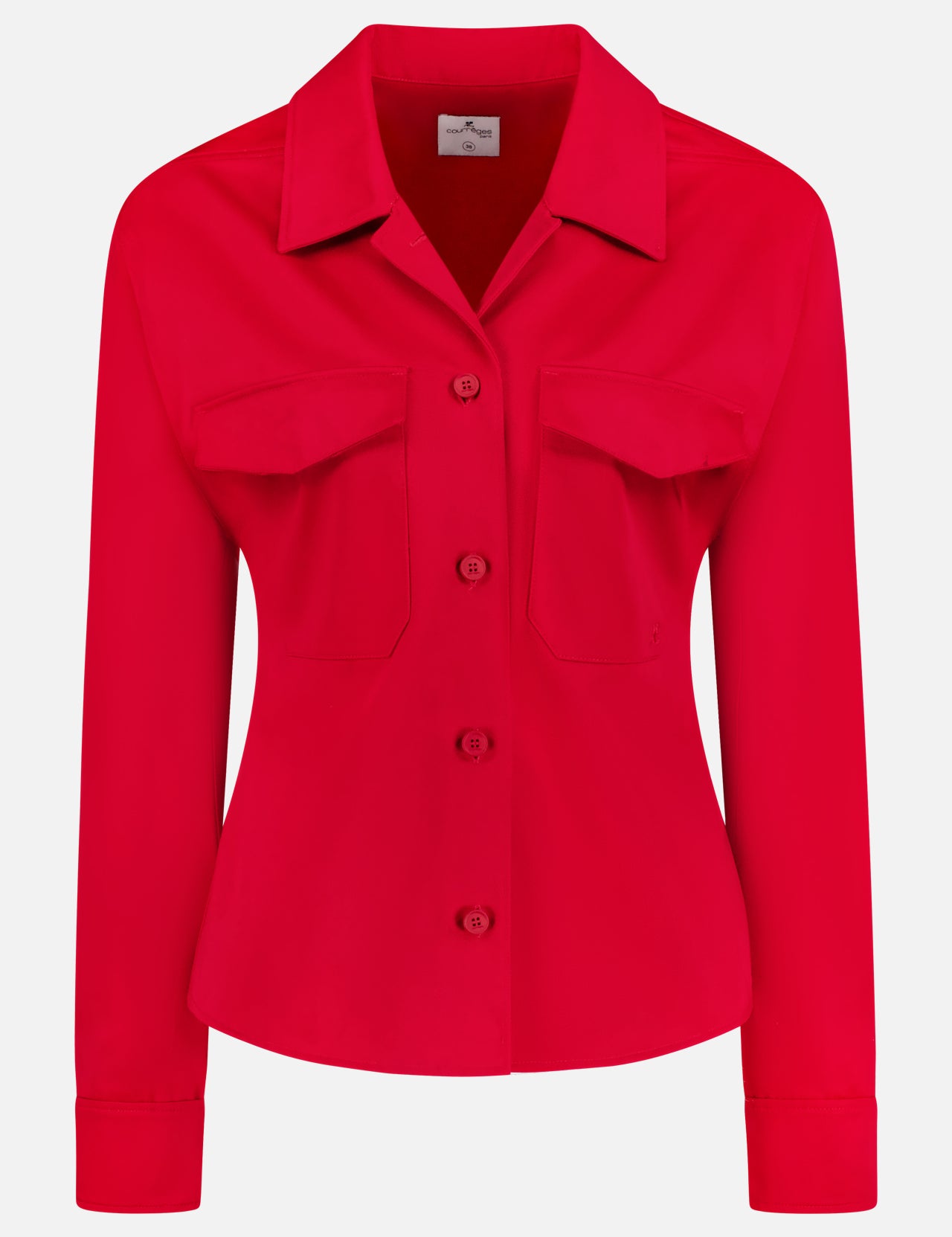 The COURRÈGES Utility Pocket Shirt is a bright ruby red, long-sleeve shirt with a collar and two front flap pockets, shown against a plain white background.