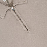 The Malfile Fleece Polo Collar Sweatshirt by C.P. COMPANY blends classic cotton polo style with designer sportswear, featuring a beige shade, visible half-zip closure, and an inner C.P. Company label.