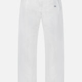 Back view of C.P. COMPANY Micro-Reps Boxy Loose Pants in white, made from high-density cotton with elastic and drawstring waistband, two buttoned back pockets, and a small tag label above the right pocket.