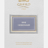 White rectangular box for Creed Iris Debonair 100 ml Fragrance with a gold logo and crest, a light purple label, and 100 ML and 3.3 FL OZ printed at the bottom corners.