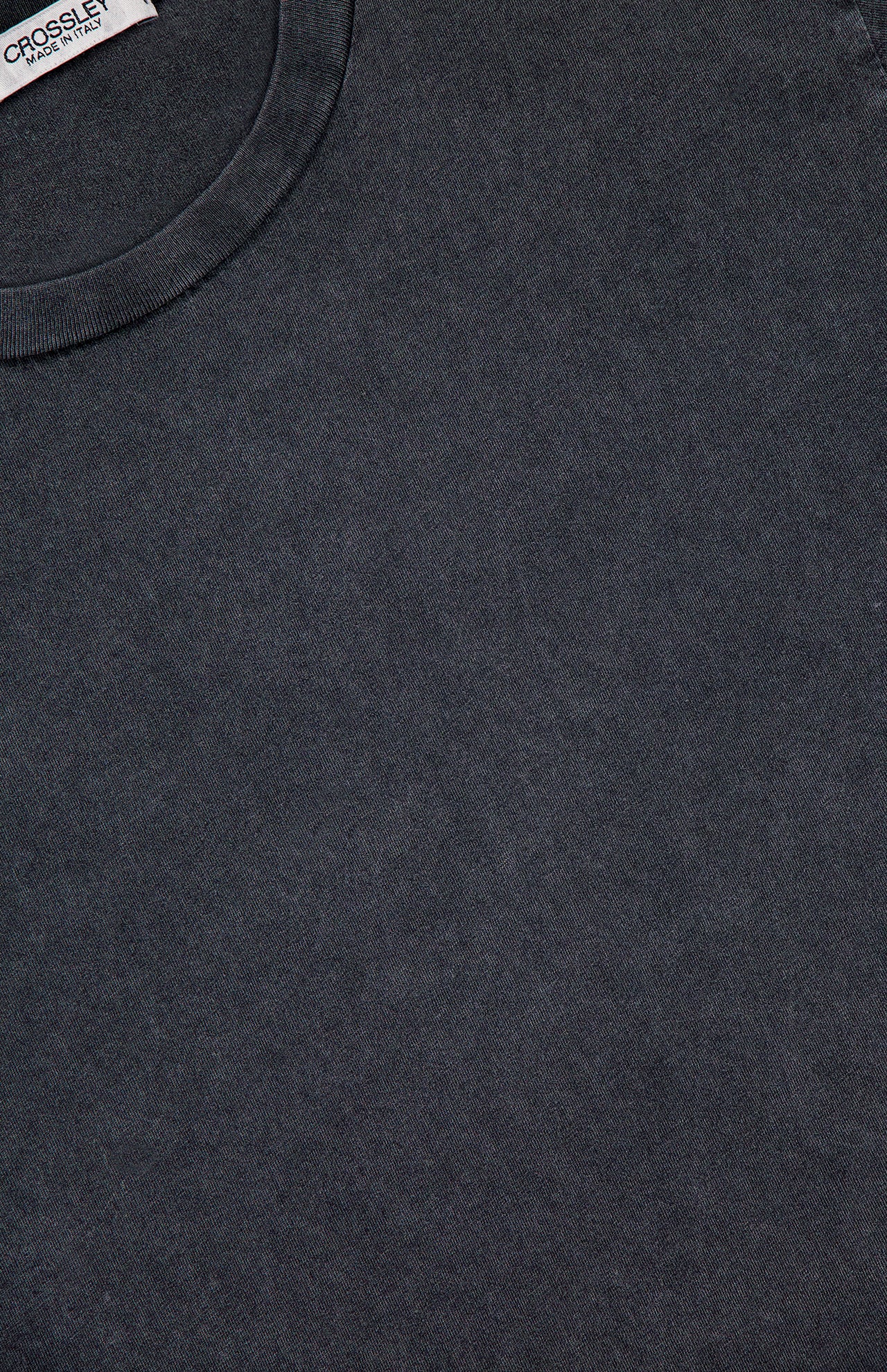 Close-up of the CROSSLEY Hunt Stone Wash Cotton Short Sleeve Crew T-shirt in dark gray, featuring a subtle washed texture and a white fabric label with CROSSLEY branding at the neckline, reflecting Italian craftsmanship.