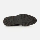 The image displays the black rubber sole of the DI BIANCO Mezzaro Bisonte Loafer in navy, featuring various textured patterns and grooves for enhanced traction, photographed from the bottom against a plain white background.