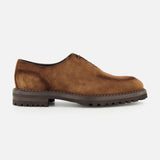 DI BIANCO’s Marche Suede Loafer in light brown features hand-stitched detailing, visible stitching, a lace-up design, and a thick dark rubber sole, shown in profile on a plain white background.