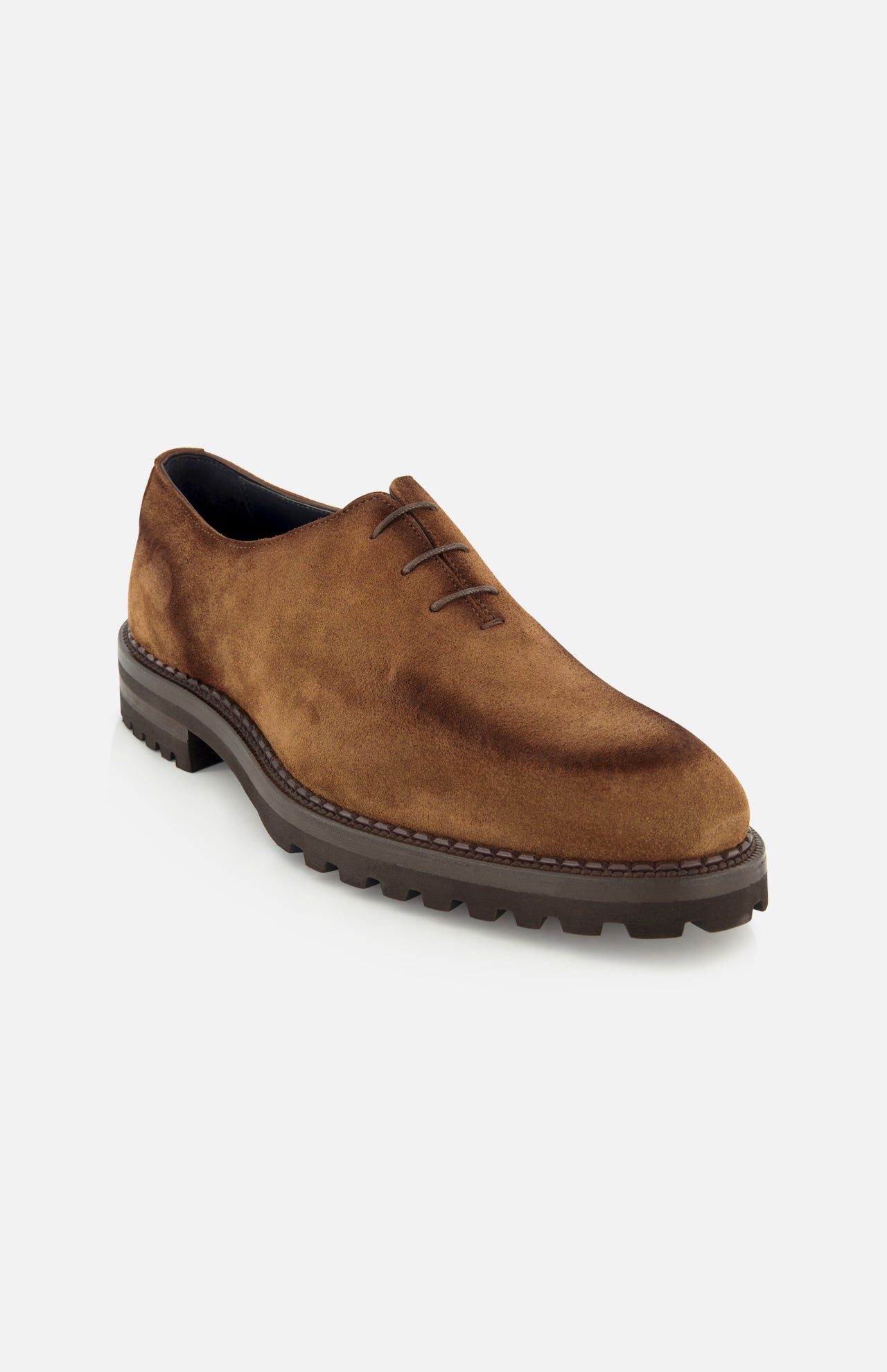 The Marche Suede Loafer by DI BIANCO is a light brown suede lace-up dress shoe featuring a chunky dark rubber sole and exquisite hand-stitching for exceptional quality and craftsmanship, shown at an angle against a plain white background.