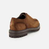 The DI BIANCO Marche Suede Loafer, a light brown suede lace-up shoe made in Italy and featuring a thick, rugged dark sole, is displayed from the back angle against a plain white background.