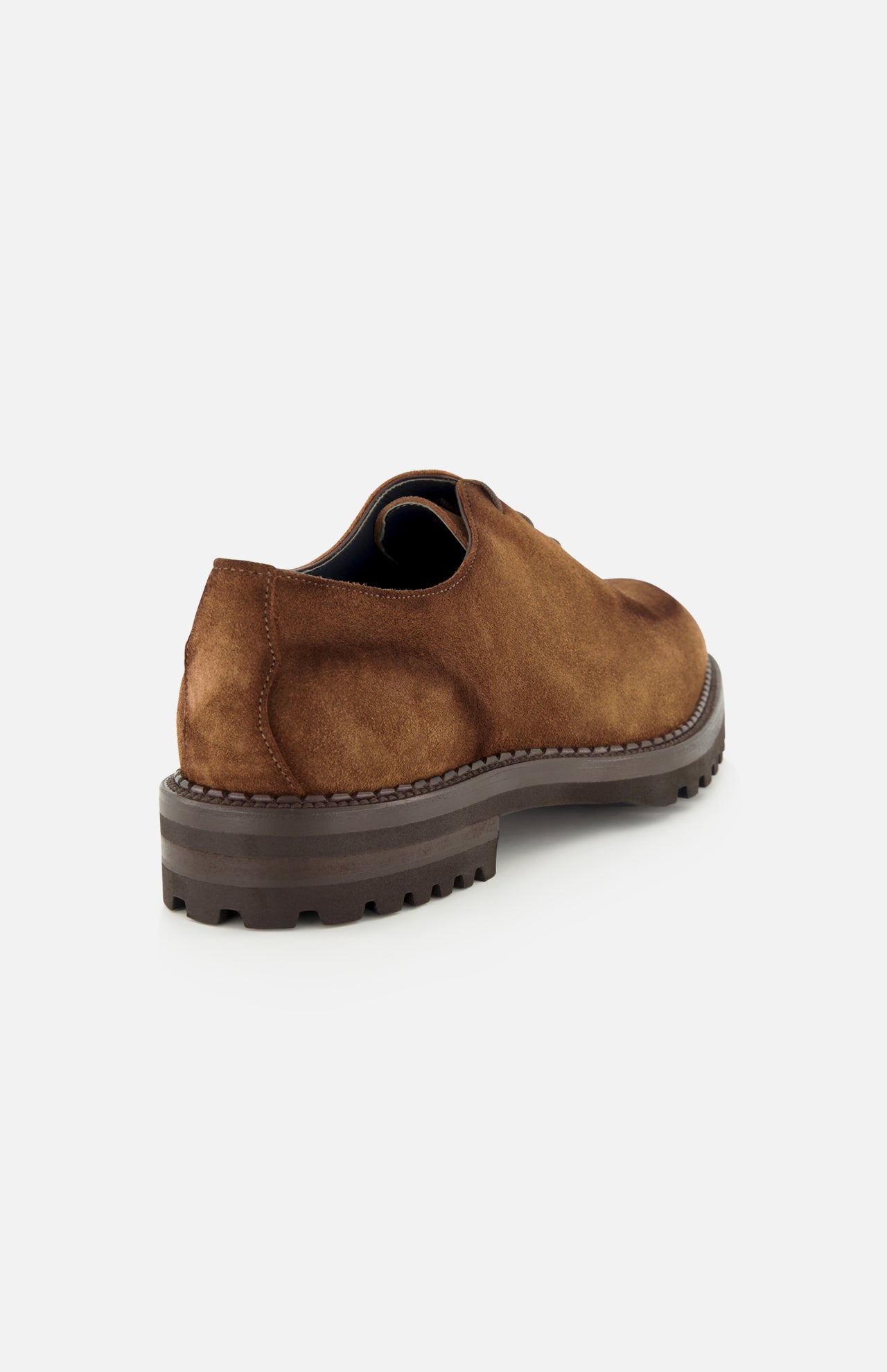 The DI BIANCO Marche Suede Loafer, a light brown suede lace-up shoe made in Italy and featuring a thick, rugged dark sole, is displayed from the back angle against a plain white background.