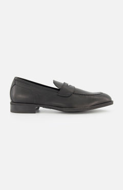 The DI BIANCO Miseno California Slip On Loafer, a black Italian-made loafer with a low heel and penny strap, is displayed in side profile on a plain white background.